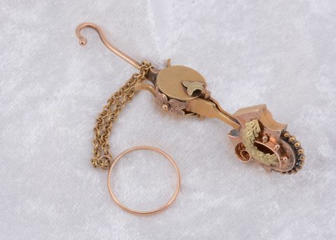 A Victorian button hook and handkerchief clasp