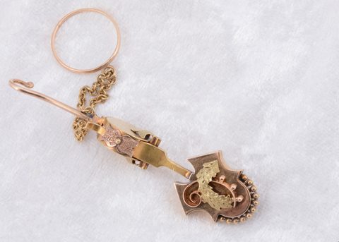 A Victorian button hook and handkerchief clasp