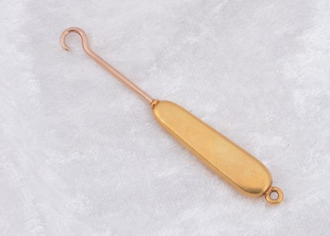 An art deco Tiffany & Co ruby and diamond button hook