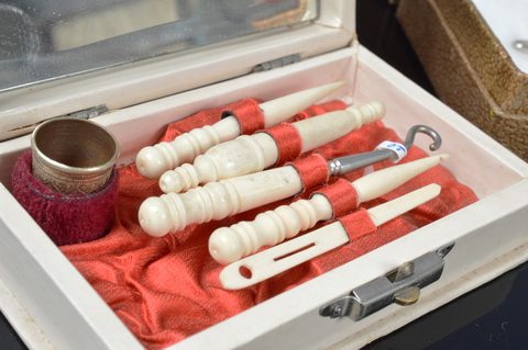 Eight cased Victorian and later bone and resin dressing table sets