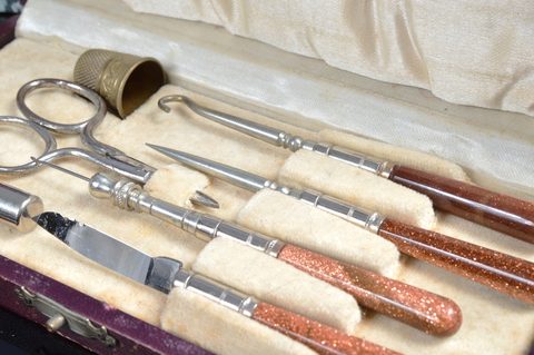 Eight cased Victorian and later bone and resin dressing table sets