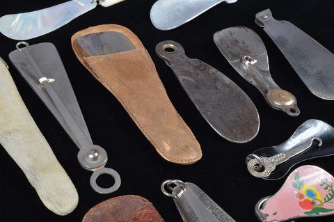 Eleven combination shoehorn and button hooks