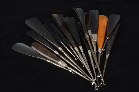 Fifteen combination antique shoehorn and button hooks