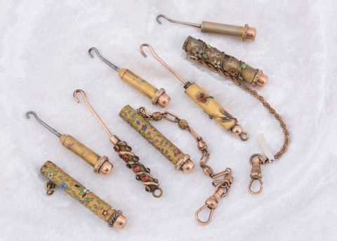 Five paste gem set and enamel button hooks