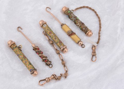 Five paste gem set and enamel button hooks