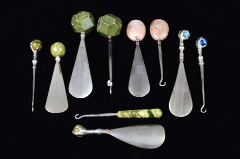 Five sets of matching button hooks and shoehorns