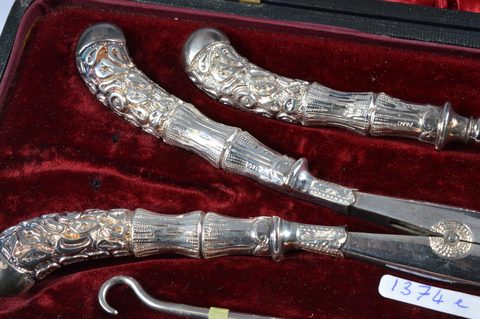 Four cased dressing table sets