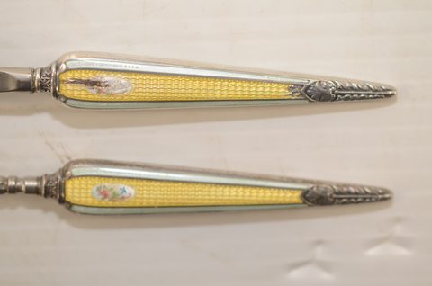 Four sets of matching guilloche enamel silver handled button hooks and shoehorns