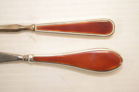 Four sets of matching guilloche enamel silver handled button hooks and shoehorns