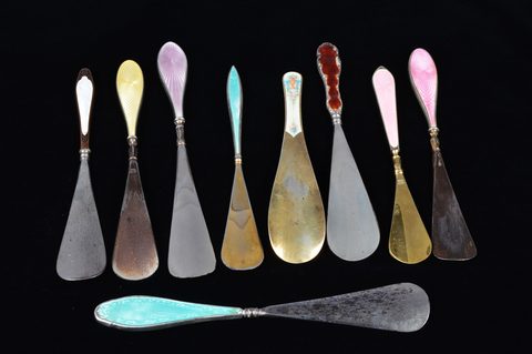 Nine guilloche enamel handled shoehorns
