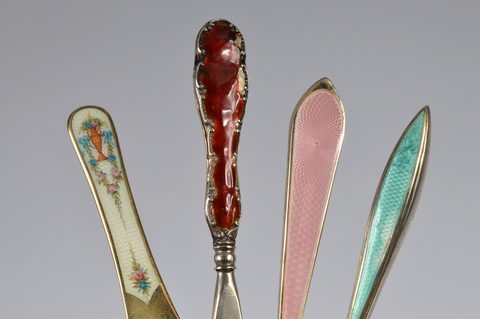 Nine guilloche enamel handled shoehorns