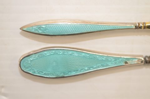 Nine guilloche enamel handled shoehorns