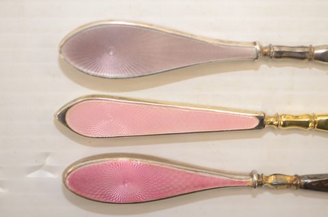 Nine guilloche enamel handled shoehorns