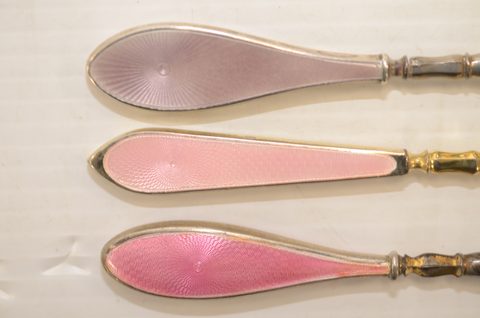 Nine guilloche enamel handled shoehorns