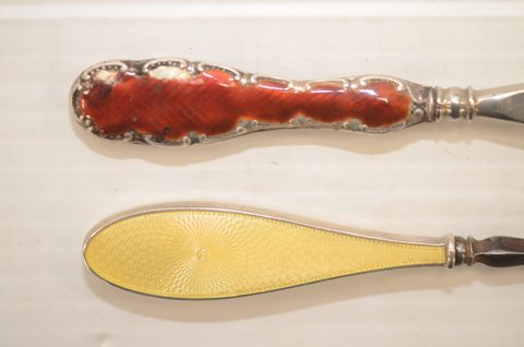 Nine guilloche enamel handled shoehorns