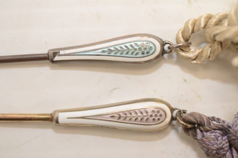 Seven sets of matching button hooks and shoehorns
