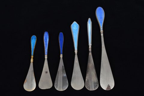 Six blue guilloche enamelled handled shoehorns