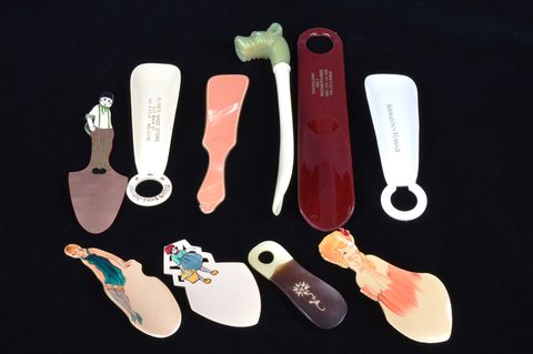 Ten plastic advertising and souvenir shoehorns
