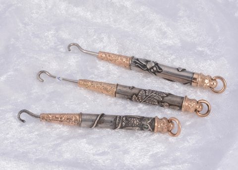 Three bi metal propelling button hooks