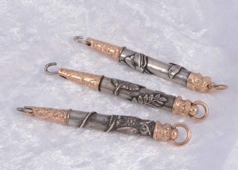 Three bi metal propelling button hooks