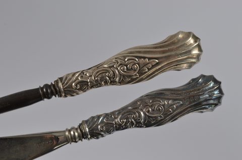 Three cased silver handled button hooks and shoehorns