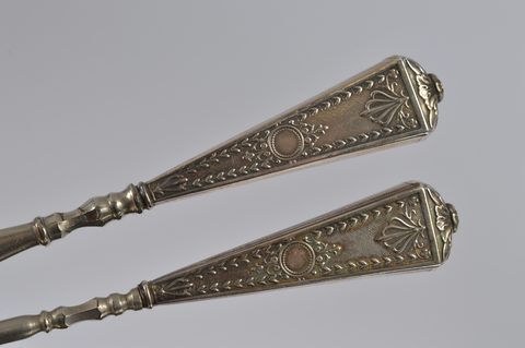 Three cased silver handled button hooks and shoehorns