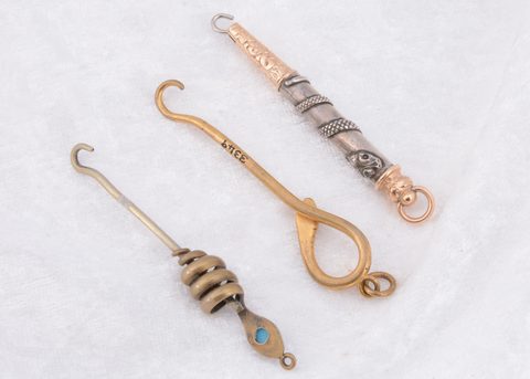 Three serpent style button hooks