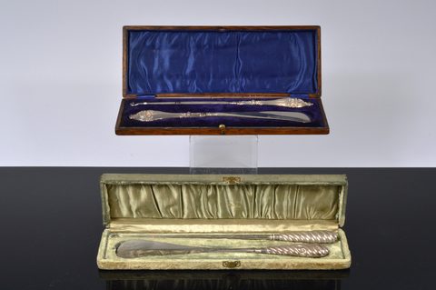 Two cased silver handled button hook and shoehorn sets