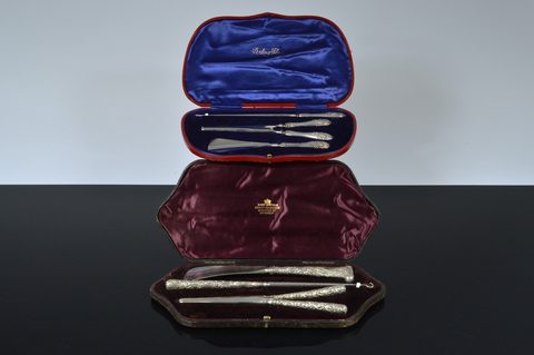 Two cased three piece silver sets