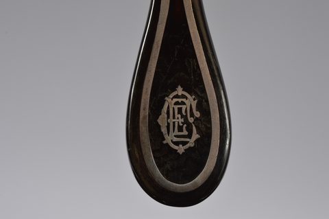 Two sets of matching button hooks and shoehorns