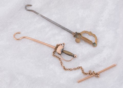 Two sword handled button hooks